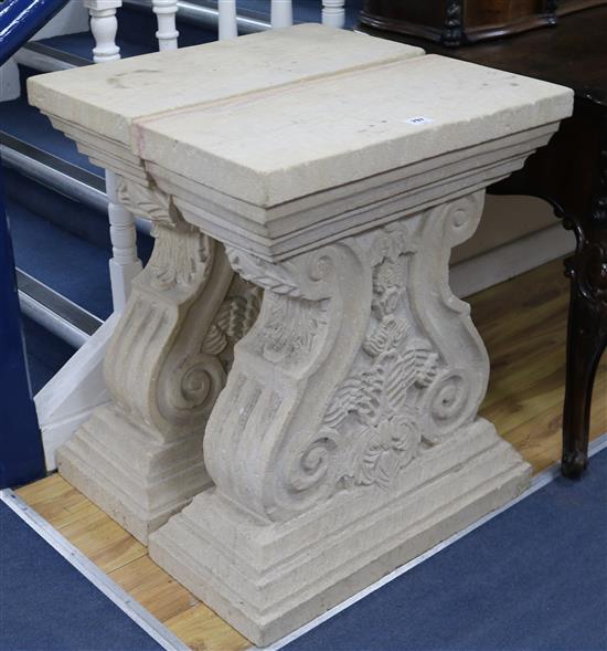 A pair of carved stone shaped columns W.64cm